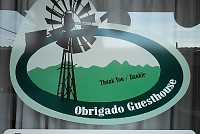 Obrigado Guest House - Logo